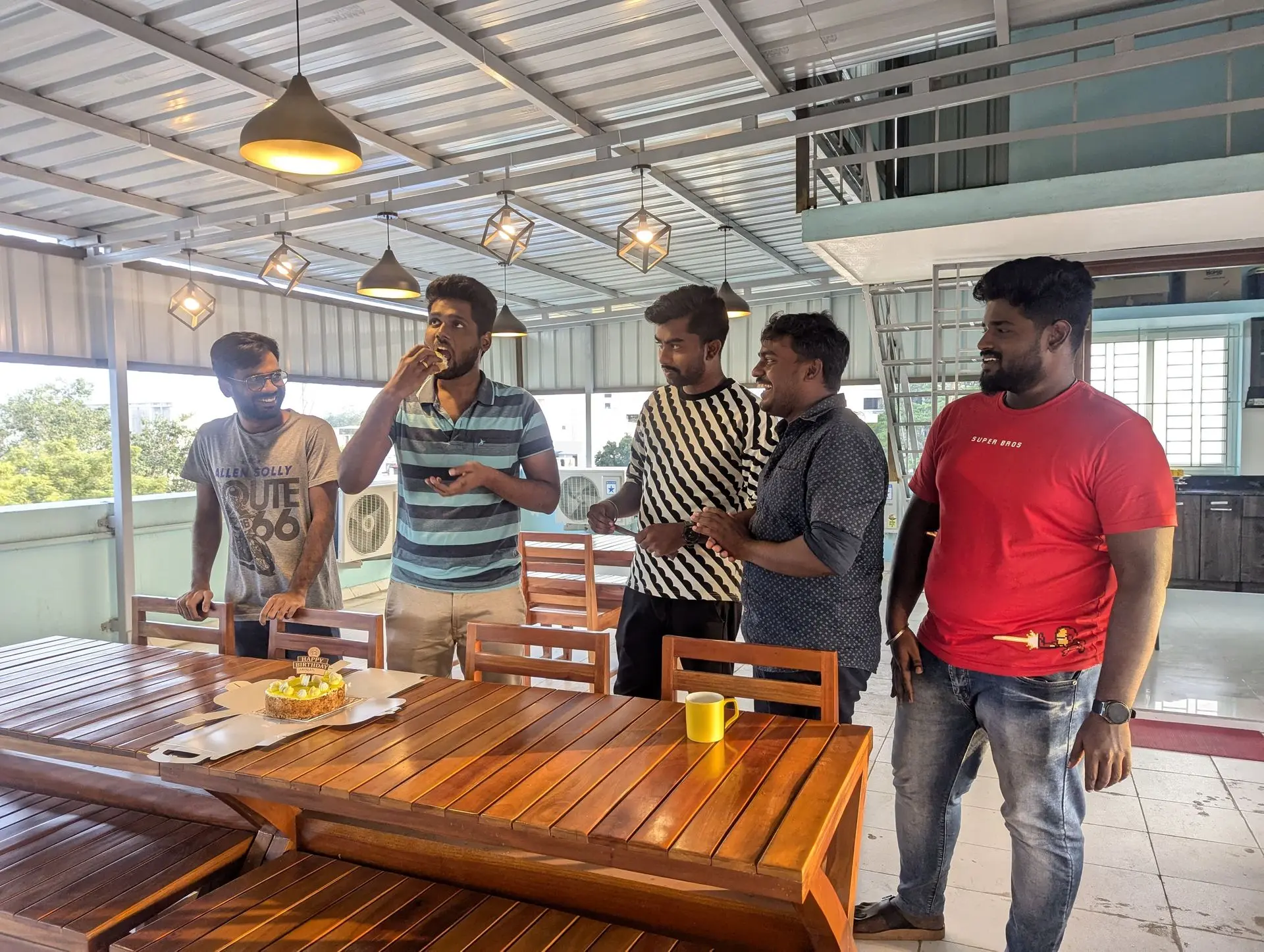 Teammates chatting at the terrace seating area