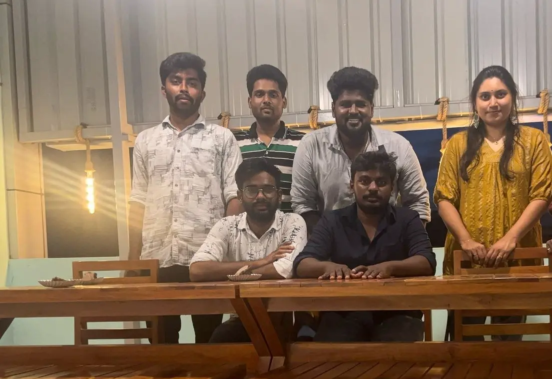 Teammates seated together at the terrace tables