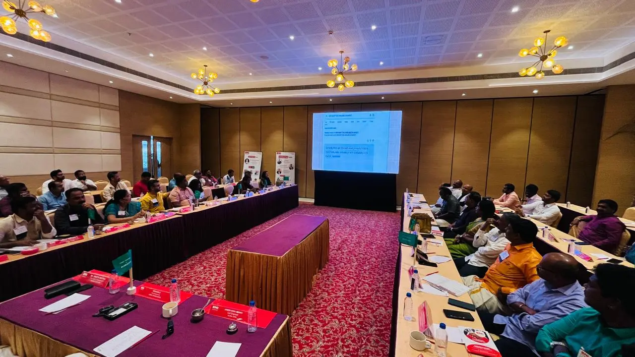 An event hall with attendees at a presentation
