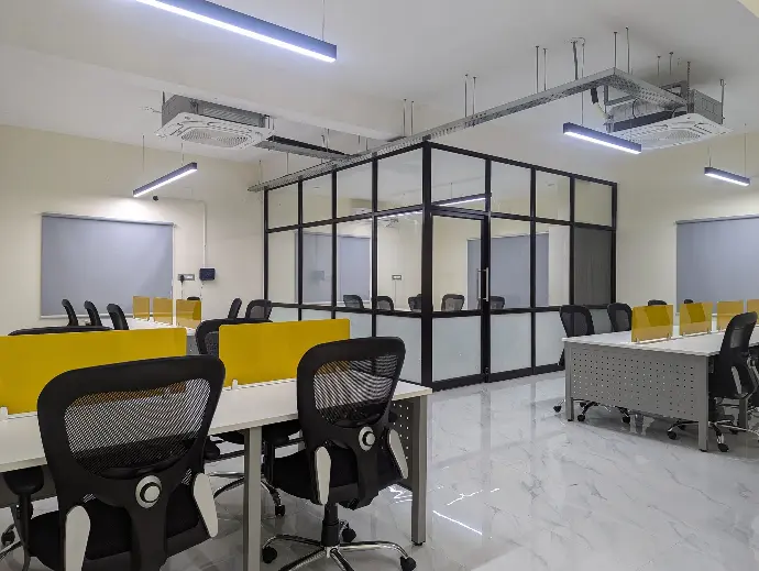 Desks and glass meeting rooms in the office