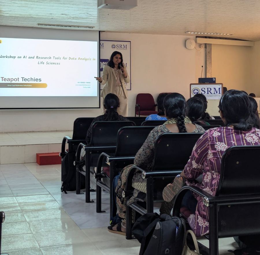 Smrithi presenting to students at SRM, with the Teapot Techies title slide on screen